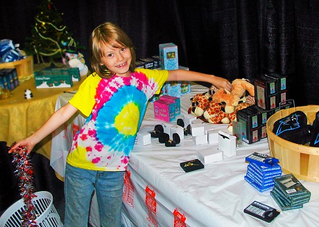 Girl picking out gifts at the Holiday Gift Shop